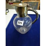 An Edwardian claret jug with plain plated mount and ovoid glass body WE DO NOT TAKE CREDIT CARDS