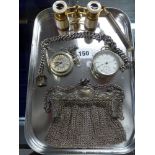 A chain mail evening bag in German silver, the frame moulded with flowers, a pair of opera glasses