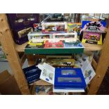 A collection of boxed and unused model automotive advertising vehicles including a set of