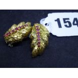 A pair of circa 1950s 18 ct gold ear clips, probably Italian, each of leaf design set with a line of