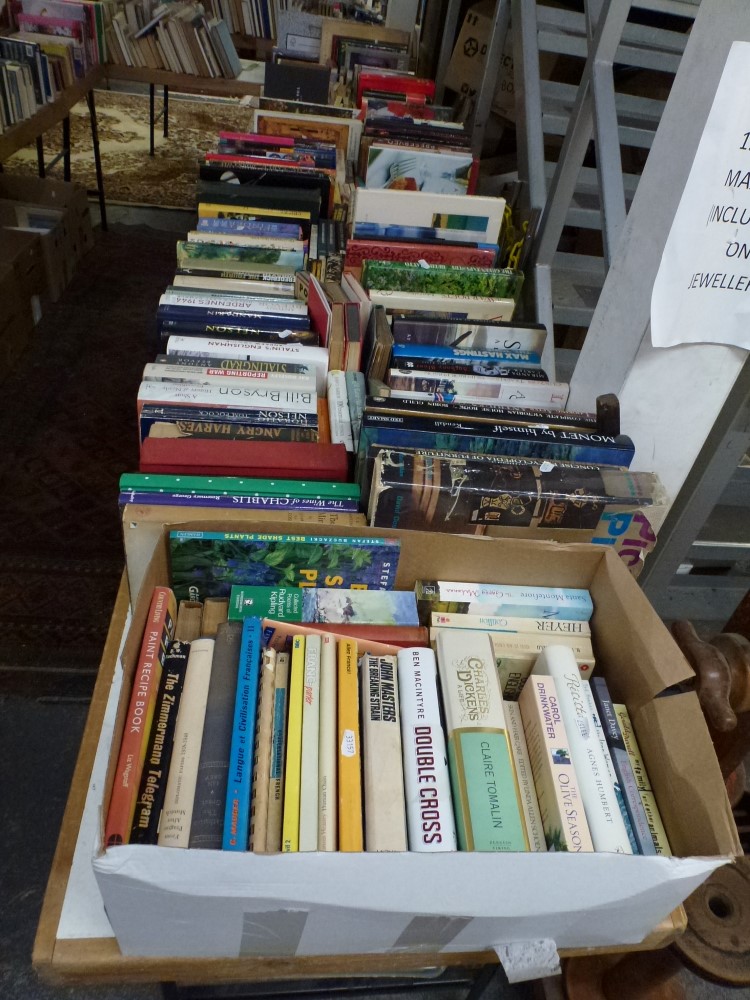 Books: on two tables and in nine boxes below, part of a library of mainly hardback books,