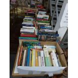 Books: on two tables and in nine boxes below, part of a library of mainly hardback books,