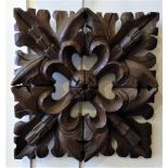 19th century carved oak ceiling boss, 36 x 5 x 35 cm and an antique scroll-carved bracket [This