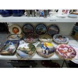 A shelf of collectors plates includes four Bradex Holy Night plates, four Wedgwood for Bradex