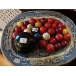 A selection of vintage snooker balls and a lignum vitae bowling ball (qty) [This lot is viewed at