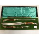An elegant Edwardian three-piece carving set by Sterling & Son, Sheffield, with EPNS and horn