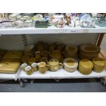 An extensive Denby Ode pattern yellow glazed pottery dinner and tea service including casserole