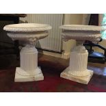 A pair of 19th century planters in painted terracotta on fluted pedestals with lion masks, 55 cm
