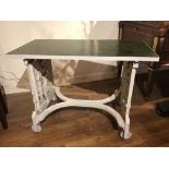 A Coalbrookdale-style 19th century painted cast iron table, with figural ends, on wheels, with
