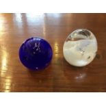 Two glass paperweights by Adam Aranson, 7 x 6 cm [This lot is viewed at and cleared from John Clay