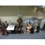 A mixed lot including a brass oil lamp with glass shade, an Oriental white glazed figural pottery