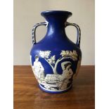 A blue Samuel Alcock & Co. copy of Portland Vase circa 1840, 26 x 17 cm [This lot is viewed at and