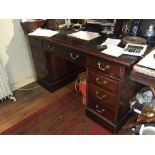 An early 20th century mahogany pedestal desk with an arrangement of nine drawers, 40 x 72 x 77 cm [