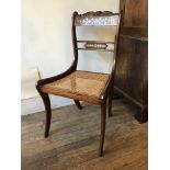 A Regency rosewood chair with cane seat and brass-inlay to back, on sabre legs, 48 x 50 x 86 cm [