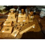 A collection of 16 Mauchline Ware items comprising two dice shakers, a needle case, a castle money
