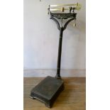 A Fairbanks American bathroom scales in cast iron and brass, with original paint and brass bottle