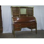 A fine French mahogany cylinder desk with 12 upper drawers flanking a mirrored cupboard, the