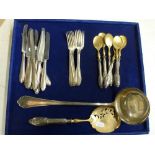 An 800 silver soup ladle, a set of eight 800 silver dessert forks and eight matching knives with