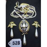 A Butler & Wilson eagle brooch and pair of ear clips set with pastes, a ditto flamingo brooch, in