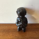 A 17th century fragmentary carved walnut cherub flautist 5 x 4 x 10 cm [This lot is viewed at and