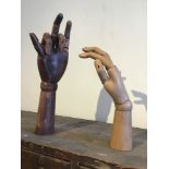 Two vintage wooden articulated hands for shop-window display, 36 x 7 cm [This lot is viewed at and