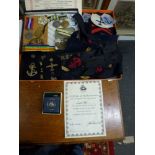 A naval lot including a large collection of uniform embroidered badges in metal thread and wool, cap