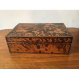 A 19th century Indian tortoiseshell sewing box with eight lidded compartments, cotton reels, etc.,