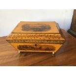 An early 19th century sarcophagus-shaped box with transfer printed decoration overall, including