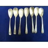 A composite set of seven Scottish provincial silver egg spoons, all with leafy stem crest and