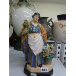 A Charles Vyse Chelsea Pottery figure of the Daffodil Woman, script monogram Chelsea and 1923