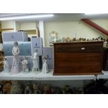 Five Lladro figurines of ladies and children with original boxes and a 19th century mahogany three