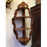 A pretty fruitwood corner shelf unit, 24 x 24 x 90 cm [This lot is viewed at and cleared from John
