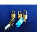 Three Louis Vuitton luggage locks each with a key. WE DO NOT TAKE CREDIT CARDS OR CASH. STORAGE IS