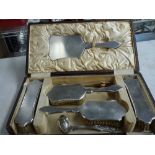 An elegant George V silver dressing table set in fitted case, in Britannia and sterling standards,