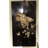 A Japanese lacquered panel of an eagle carved from bone, mother-of-pearl and wood, circa 1900, 48