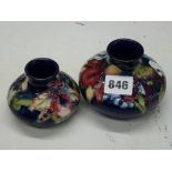 Two vintage Moorcroft squat baluster vases, decorated in Orchid, Slipper Orchid and Blossom pattern,
