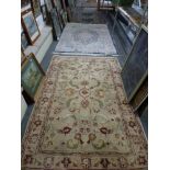 Four various Eastern woollen rugs [floor by silver-plate shelves] WE DO NOT TAKE CREDIT CARDS OR