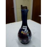 A 1972 Moorcroft Centenary bottle vase in Orchid and Slipper Orchid pattern, circular printed mark
