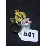 9 ct gold, comprising: a broad wedding band, a naval brooch, a ring with red and white stones in