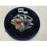 A vintage Moorcroft blue-ground dish with Orchid pattern, WM painted mark in blue, impressed marks