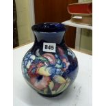 A fine vintage Moorcroft baluster vase in Orchid and Blossom pattern, WM script mark in blue, also