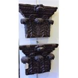 A pair of George III oak flat back Corinthian capitals, retaining numerous paint layers, 35 x 12 x