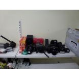 A camera lot including a Ricoh KR10, a Yashica Minimatic C, an Akita Royal 1, an Elmo Super 8