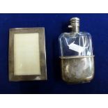A late Victorian hip flask, by Samuel Morden & Co., in glass with silver twist top and slip-on