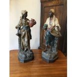 A pair of late 19th century Moorish figures in painted terracotta by Johann Maresh, 15 x 15 x 49