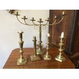 Four brass candlesticks and a brass Menorah, 57 x 50 x 14 cm [This lot is viewed at and cleared from