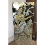 An Art Deco Indian mirror, reverse decorated in relief with an exotic dancer with gilt detail,
