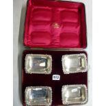 A good set of four Edwardian silver reproduction salts, in original fitted case, by the Goldsmiths &