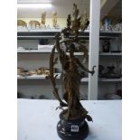 A French bronze table lamp, circa 1900, cast as Diana the Huntress standing within a leafy scroll on