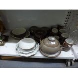 A Denby part tea and dinner service including tureen and cover, serving dishes, flan dishes, etc.